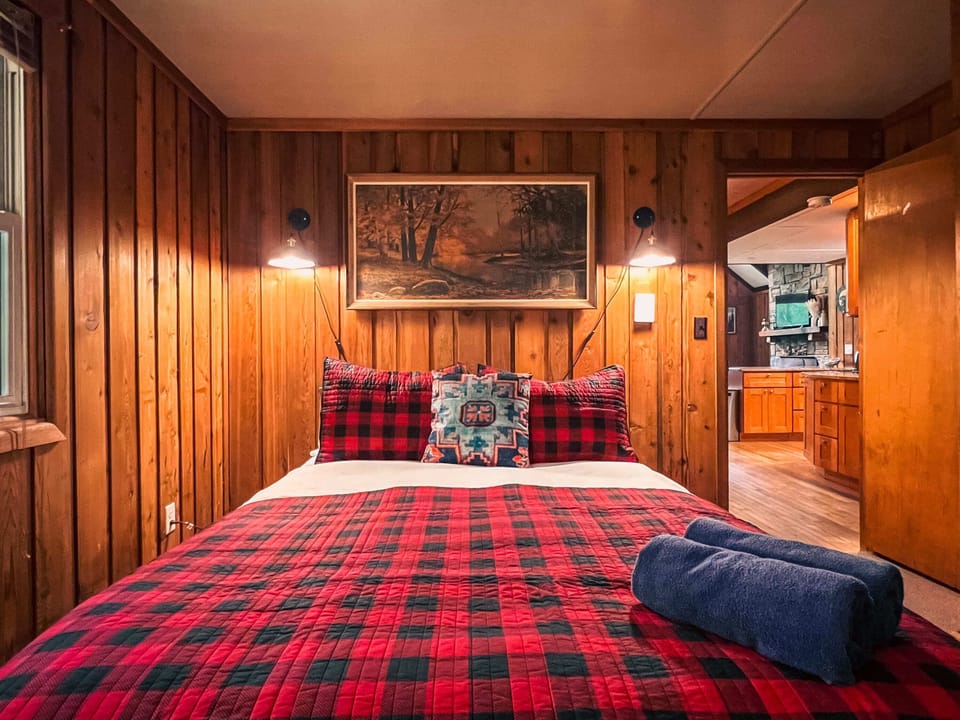 Step into our charming second bedroom, where cozy vibes reign supreme.