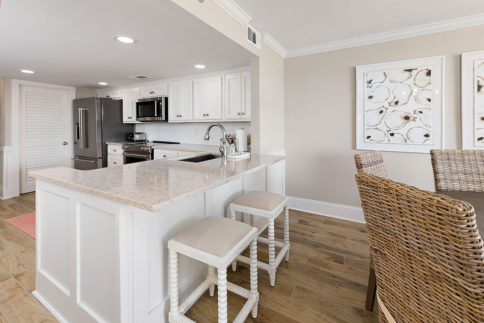 The breakfast bar makes for an easy place to grab a snack or sip your morning coffee.