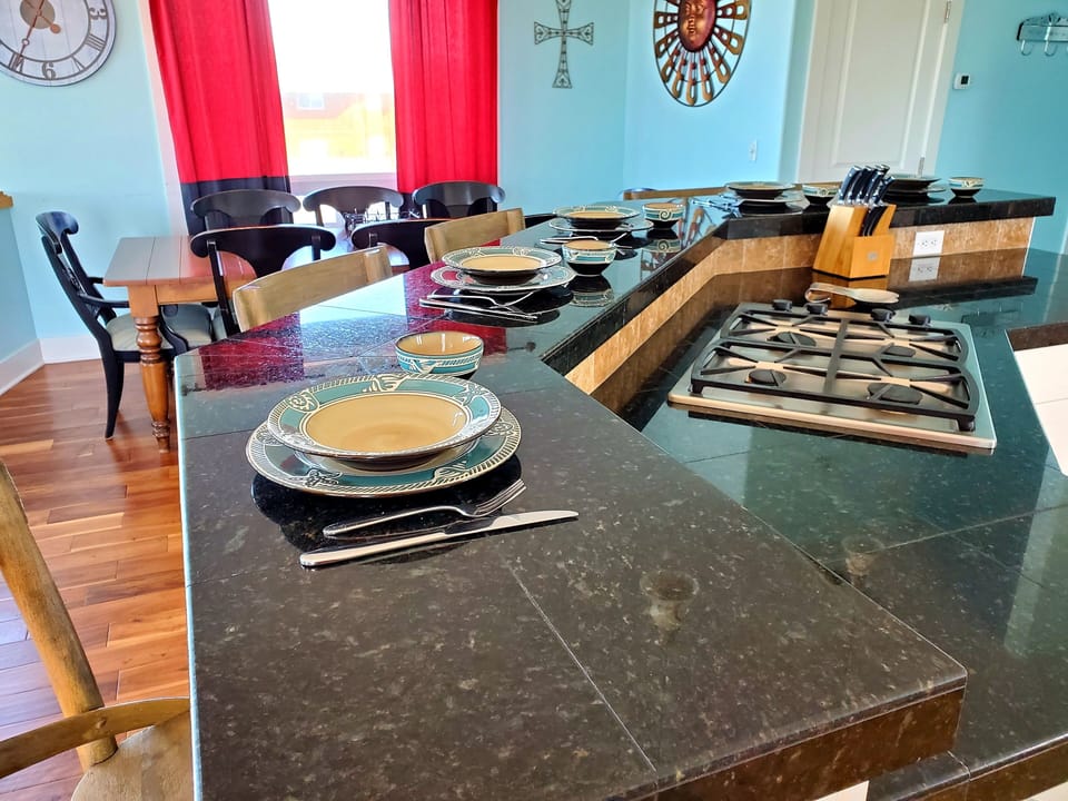 Spacious island bar and dining table, seat 16 comfortably with table leaf added.