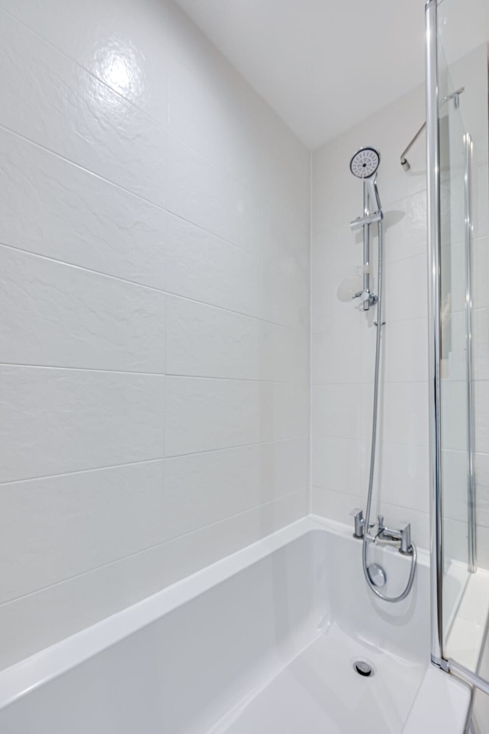 Bathroom with a shower over bath and complimentary toiletries provided.