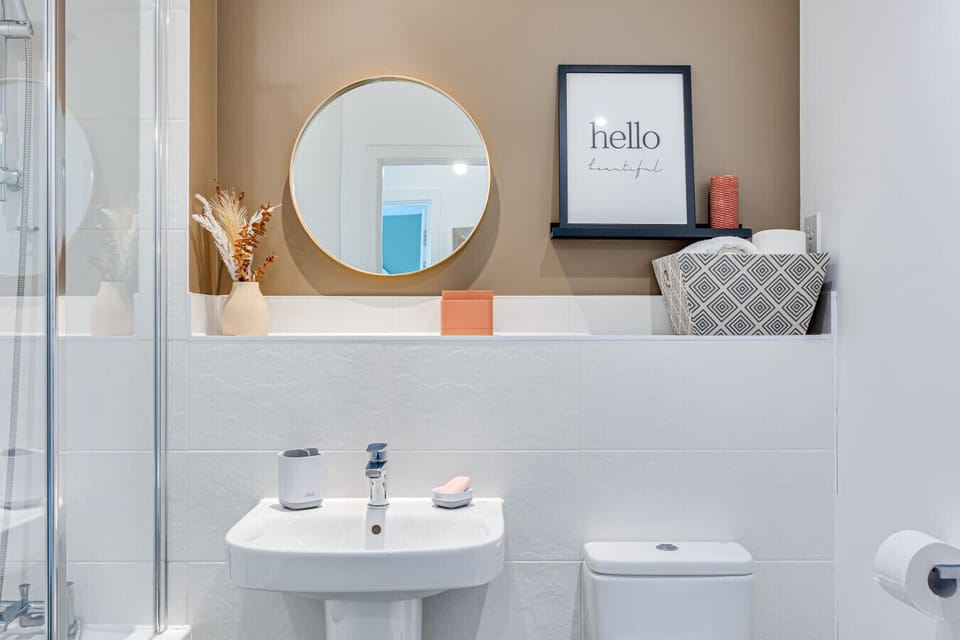 Bathroom with a shower over bath and complimentary toiletries provided.