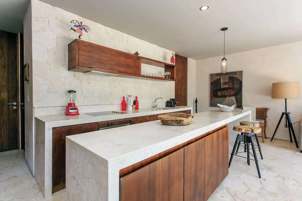 Heading back through the kitchen area, we have the washer & dryer on the left, and then the bedrooms…