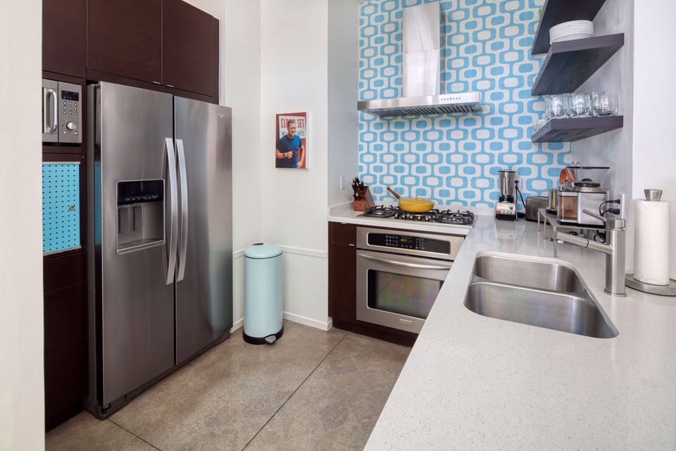 Kitchen with stainless steel appliances and 5 burner gas stovetop