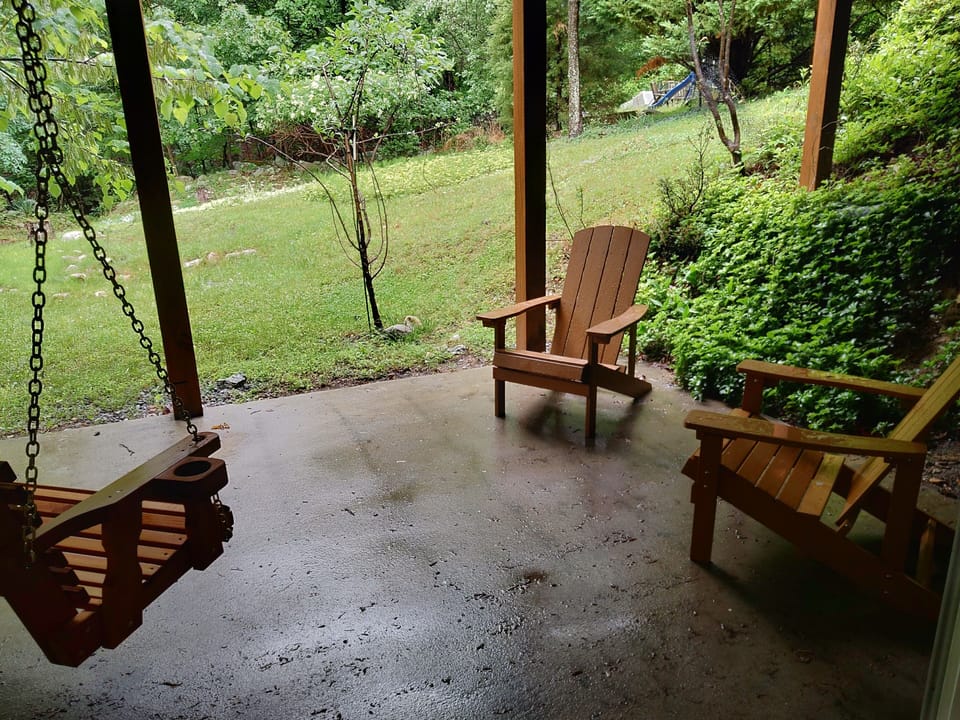 swing area with two Adirondack chairs