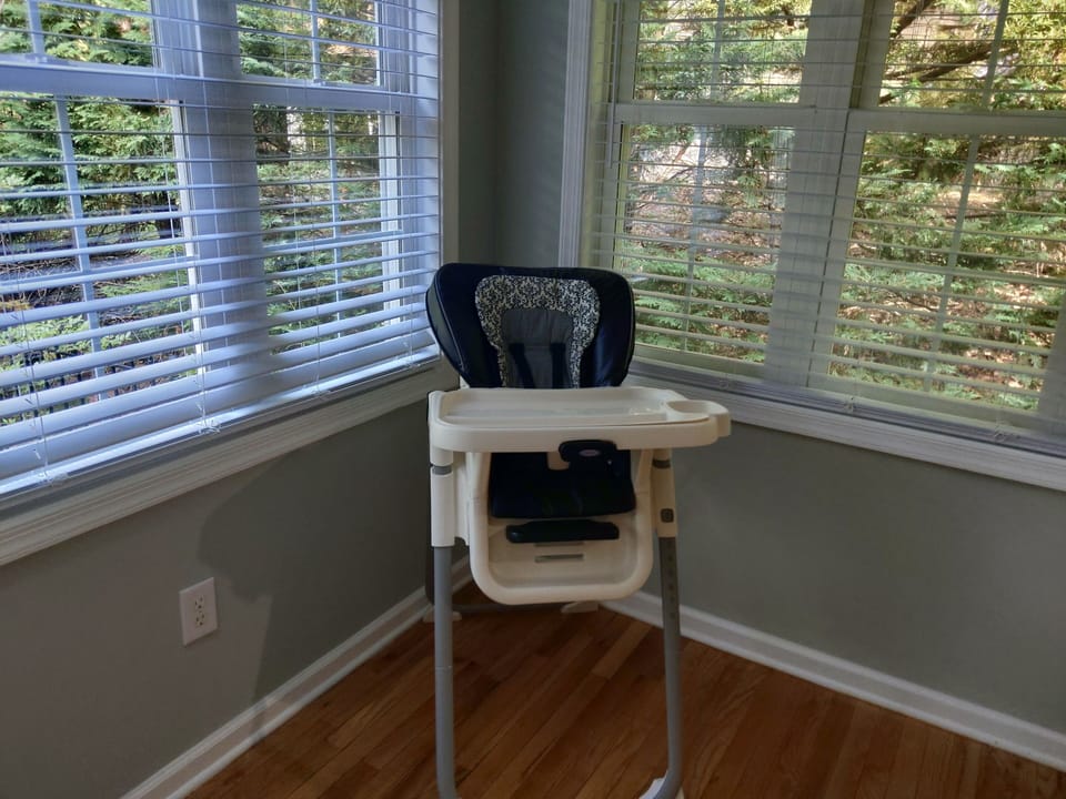 High chair in home in master closet .