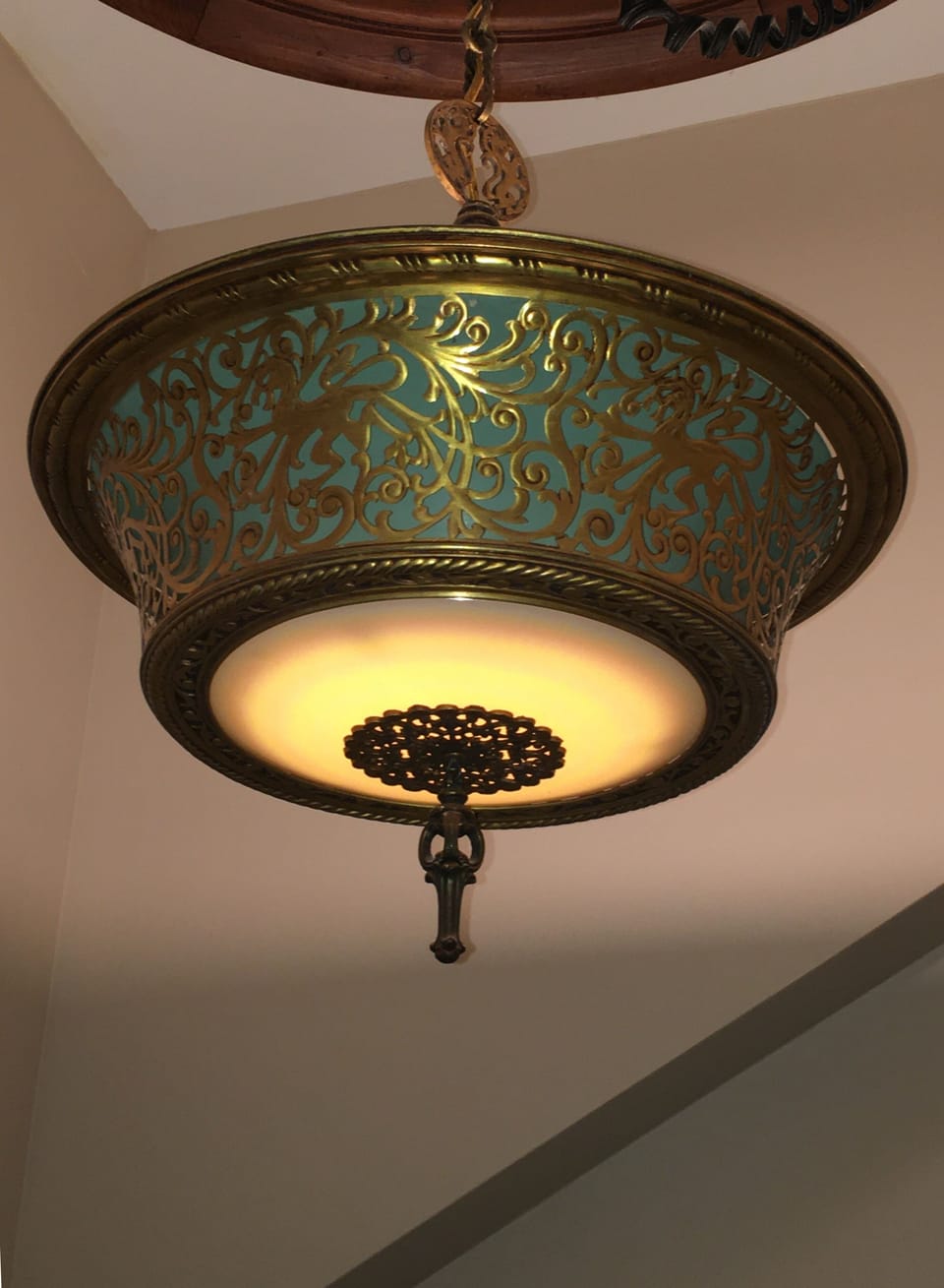 Decorative chandelier in the stairway.