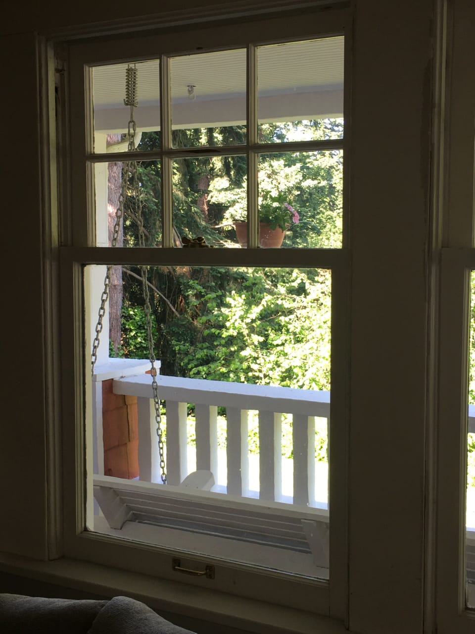 Original leaded glass double-hung windows in the living room, entry, & bedrooms.