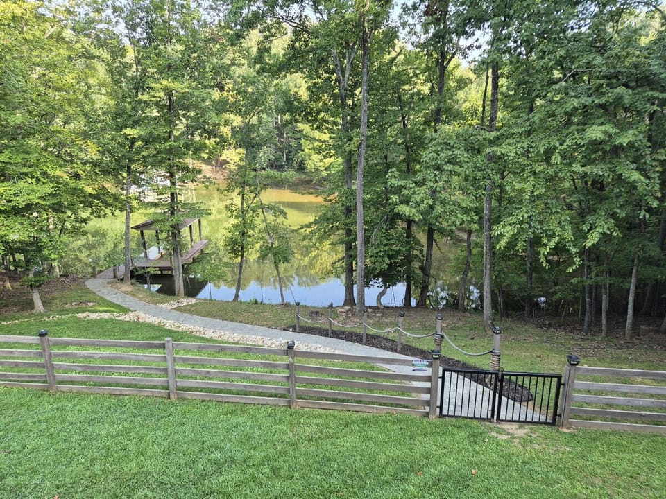 Discover a moderately sloped yard with well-placed steps guiding you to the lake.