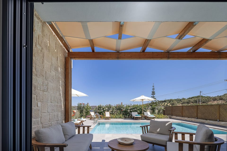 Lounge by the pool on comfortable sunbeds, surrounded by nature.