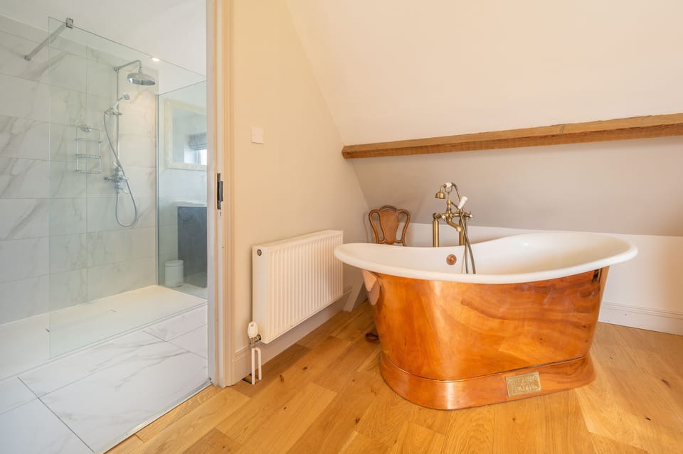 First floor: Copper stand alone bath in the master bedroom