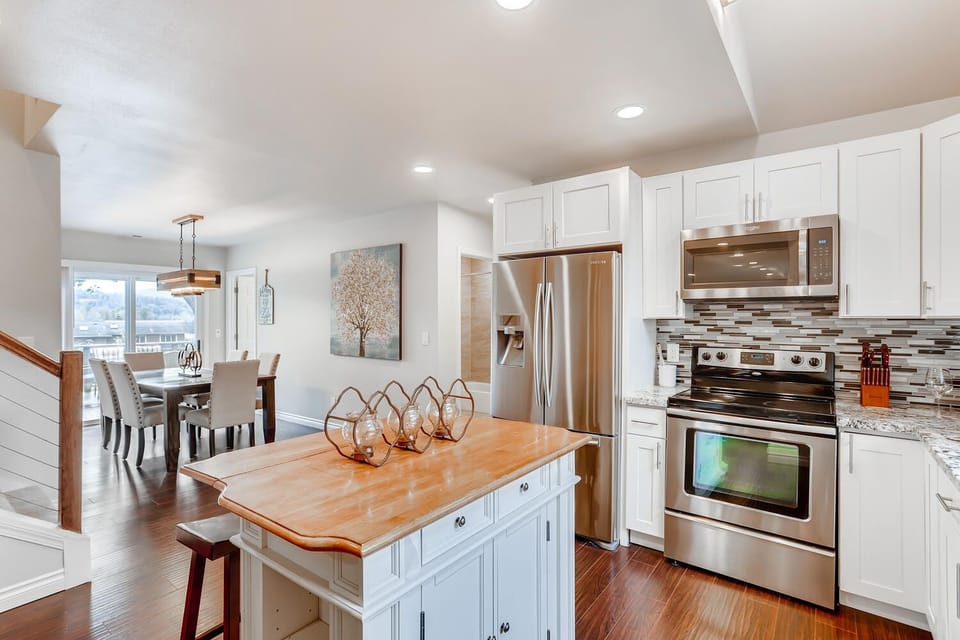 Big Kitchen with Farmhouse Island with 2 bar stools
