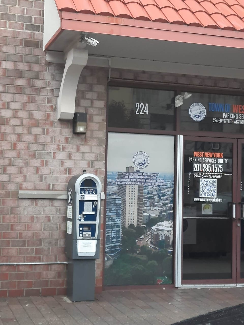 Parking station for purchasing visitor's parking pass/permit