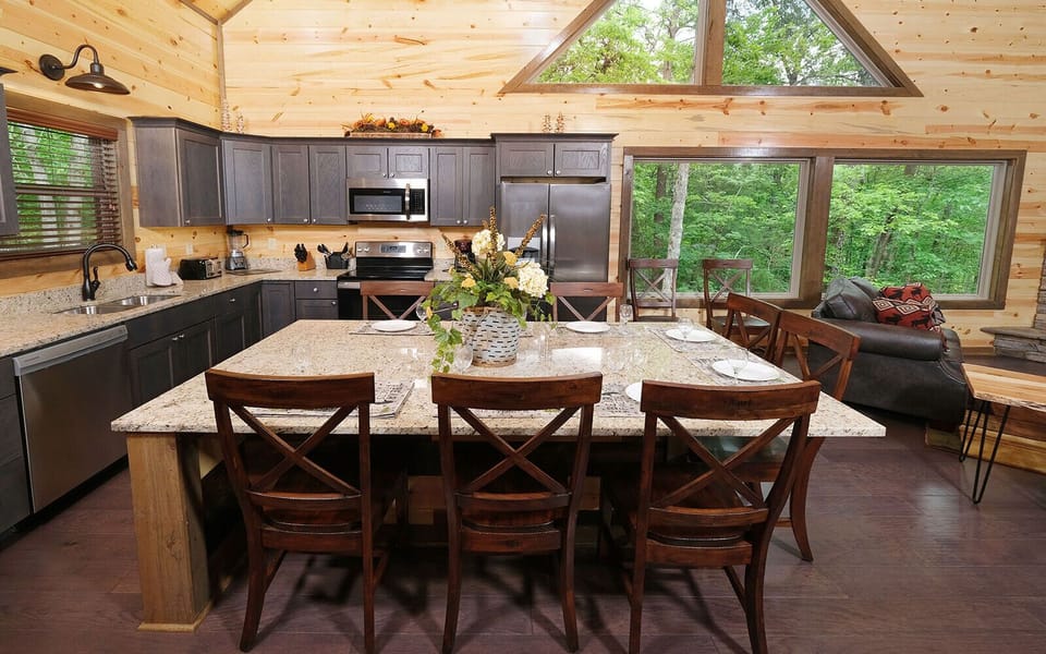 Fully-Equipped Kitchen with an Island Seating Area for Dining