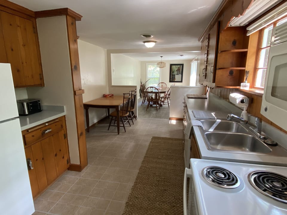 Lots of seating and large eating area. Slider to back yard and patio.