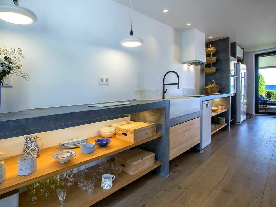 Countertop, Property, Tap, Cabinetry, Sink, Plumbing Fixture, Plant, Wood, Interior Design, Lighting