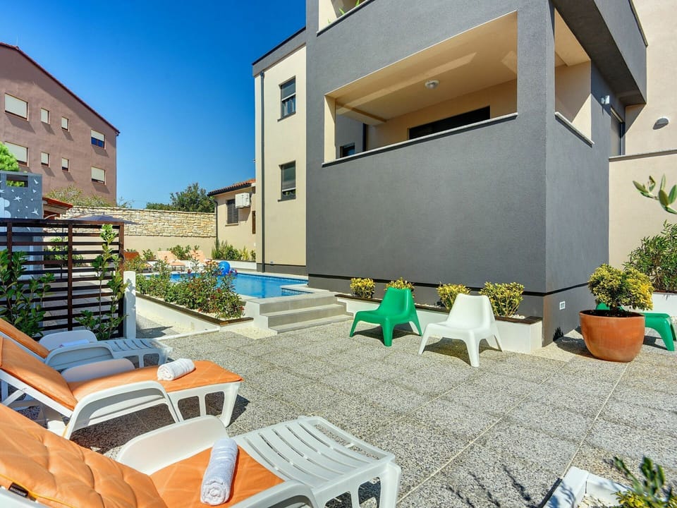 Plant, Building, Property, Furniture, Sky, Window, Interior Design, Shade, Architecture, Outdoor Furniture