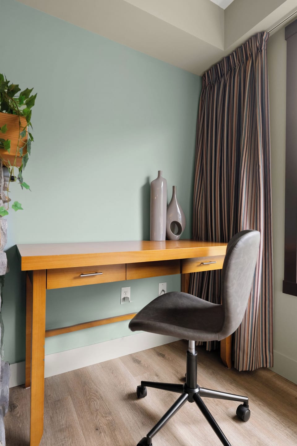 Comfortable dedicated workspace featuring an adjustable chair and natural light.