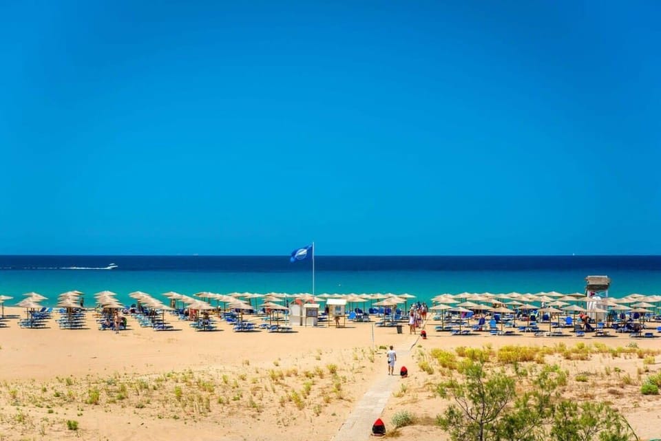 Feel the golden sand beneath your feet at Kalogria Beach. (500m)