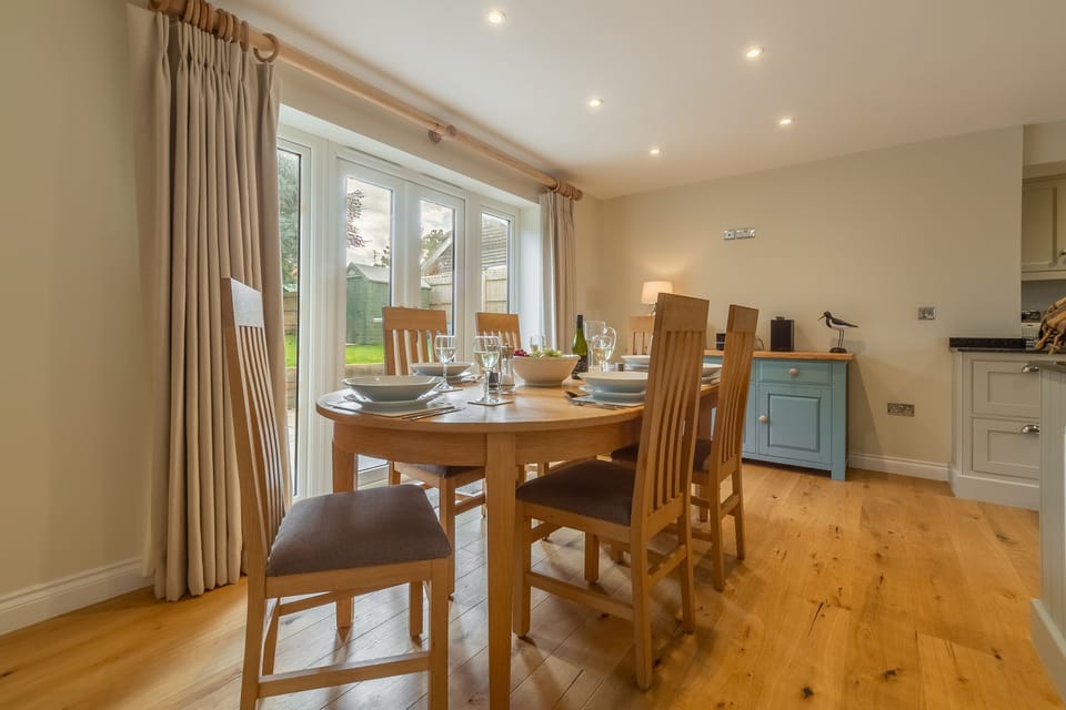 Ground floor: French doors lead from the dining area into the garden