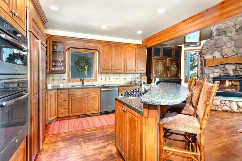 Fully equipped kitchen with double ovens, gas range, and plenty of prep space for group meals.
