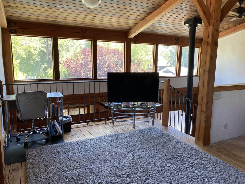 Gorgeous loft space upstairs with TV, office space and lovely views of the neighborhood