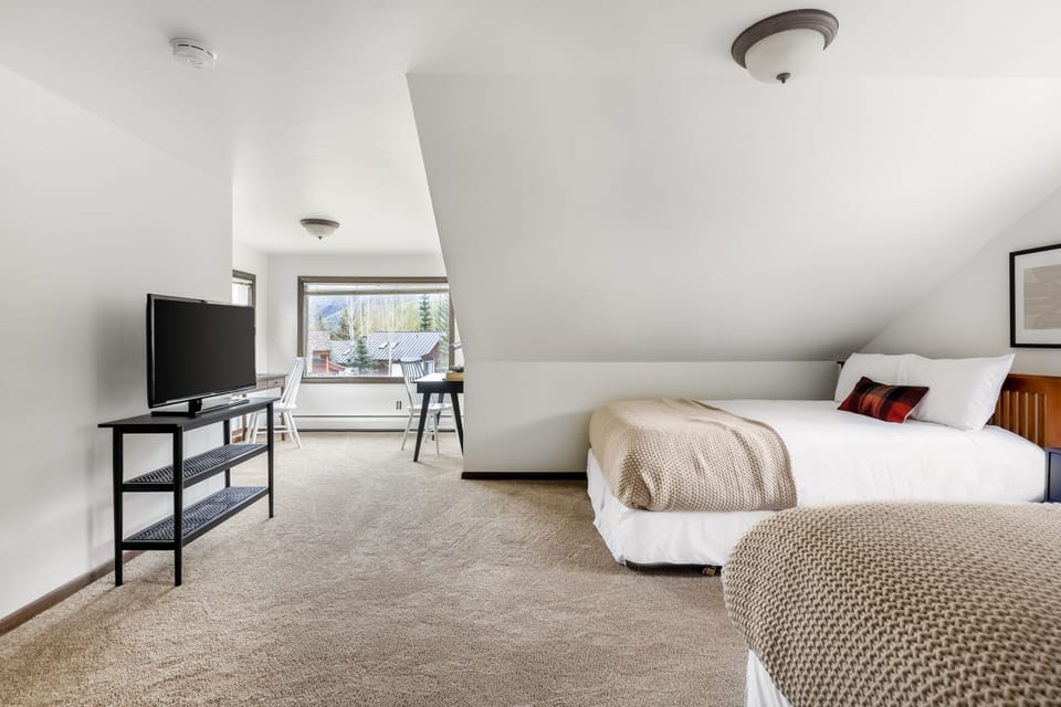Bedroom 5: Comfort meets entertainment.