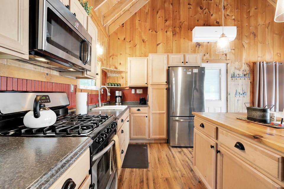 The kitchen offers full sized refrigerator, gas range, and microwave.  