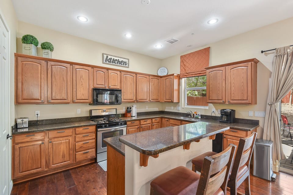Kitchen with breakfast bar seating. 