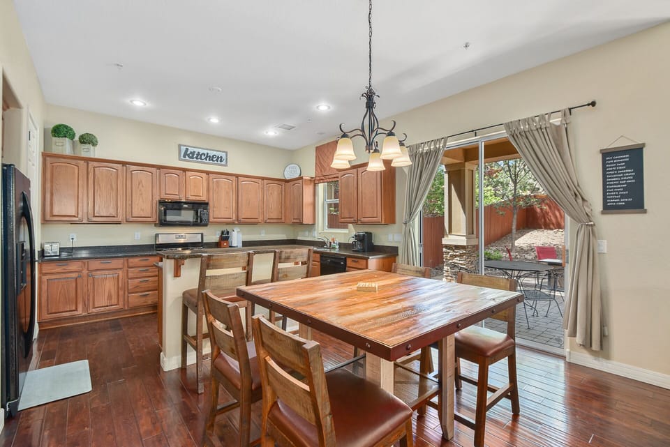 Dining table and the kitchen.