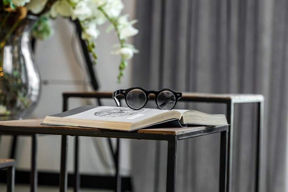 A focused shot of a modern table set with elegant drinkware and minimalist decor.
