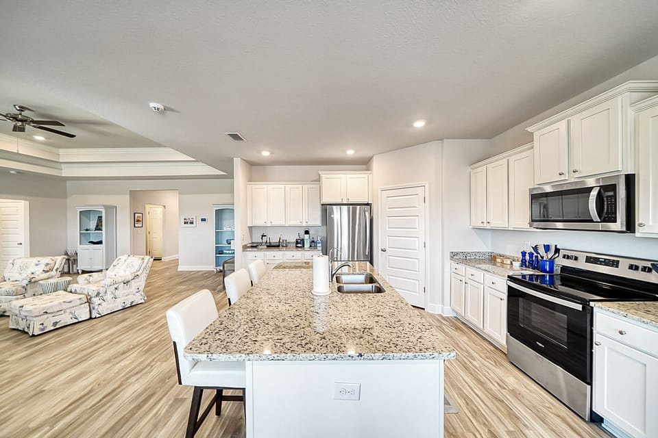 Fully stocked kitchen with stone countertops