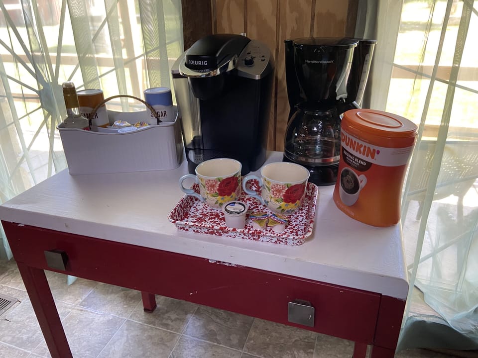 Coffee bar with everything you need to enjoy a cup of coffee on the porch. 
