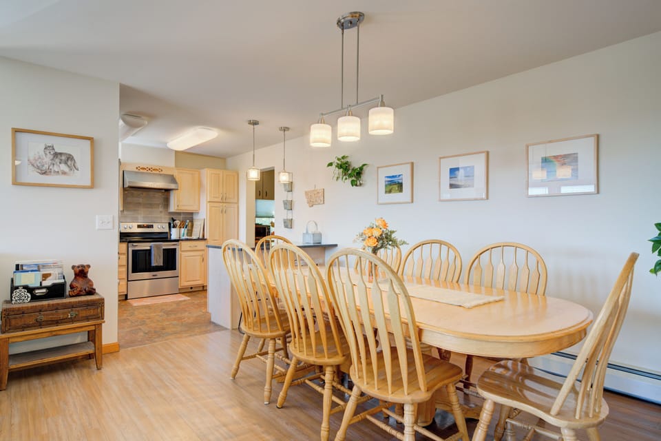 Oak dining table with seating for 8-10 and breakfast bar seating for 2