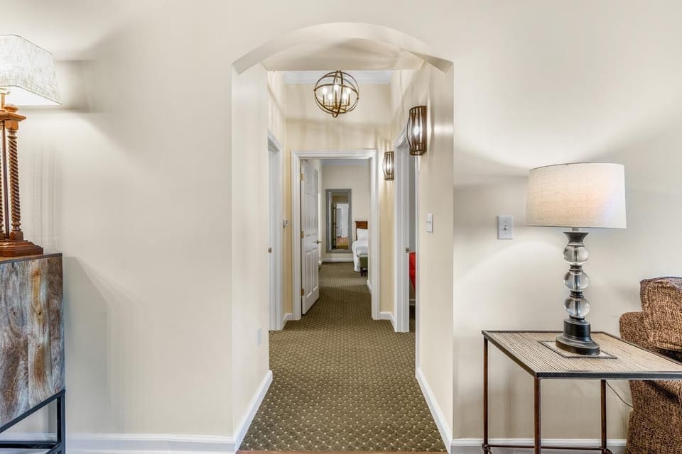 Hallway leading to 2nd and 3rd oceanfront bedrooms and full bathroom with walk-in shower