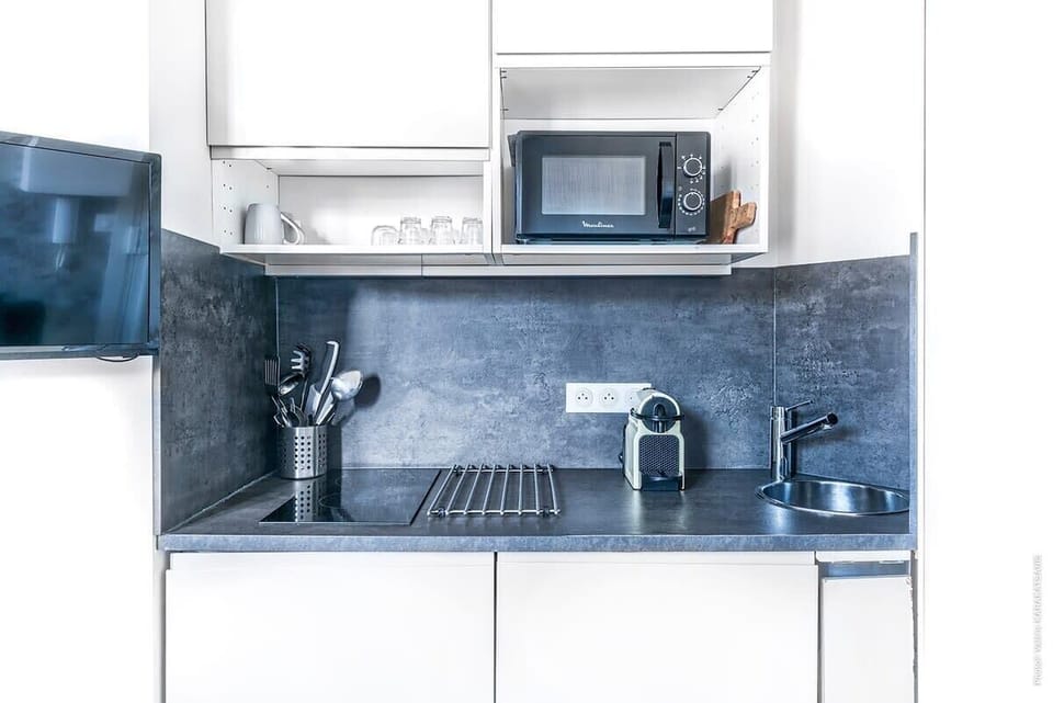 Fully equipped kitchen: microwave, electric stove,  coffee machine, toaster..