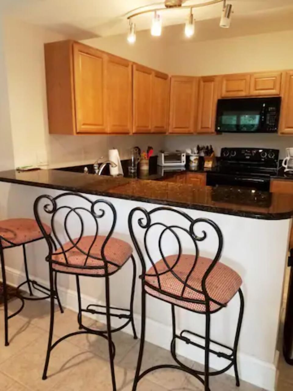 Granite breakfast bar for snacks and serving made easy.