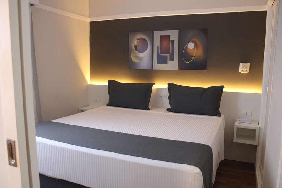 Premium Room | Minibar, in-room safe, laptop workspace, blackout drapes