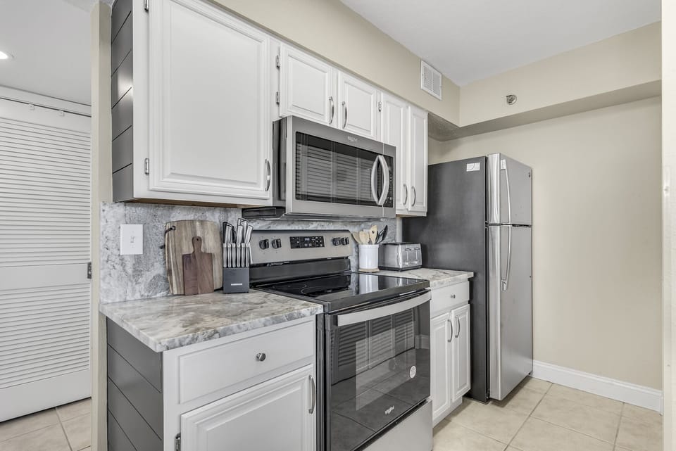 Your fully equipped kitchen features modern appliances and marble countertops, perfect for preparing meals during your stay.