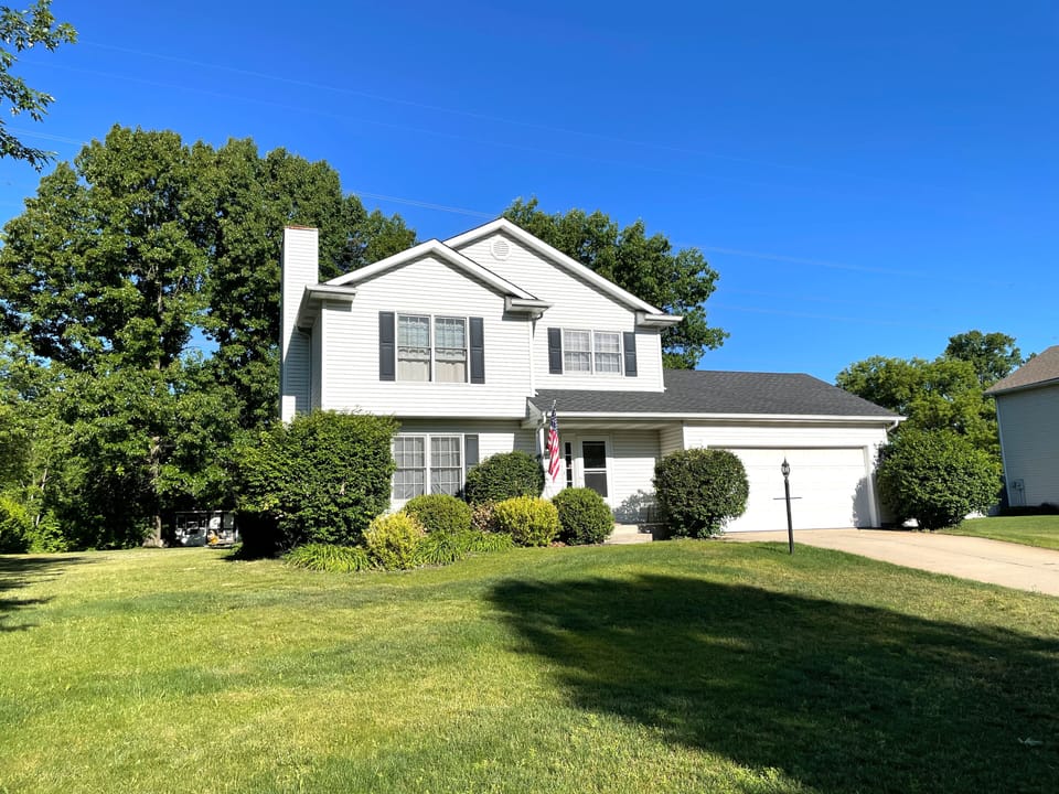 Outside, two-stall garage, ample parking in driveway and street