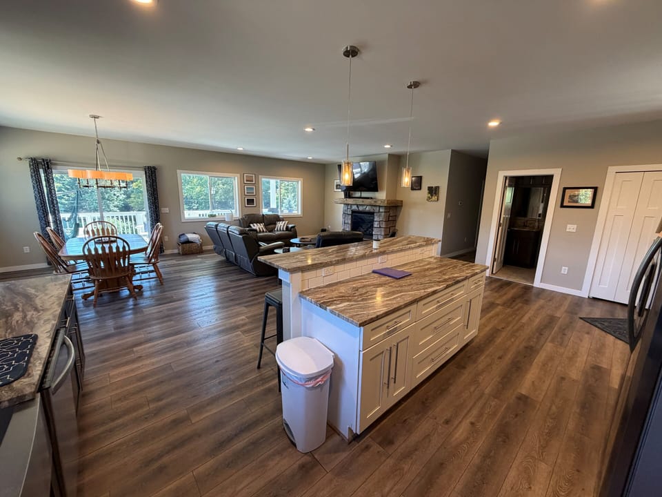 First floor open concept family room / kitchen with dining table.  Pic 3