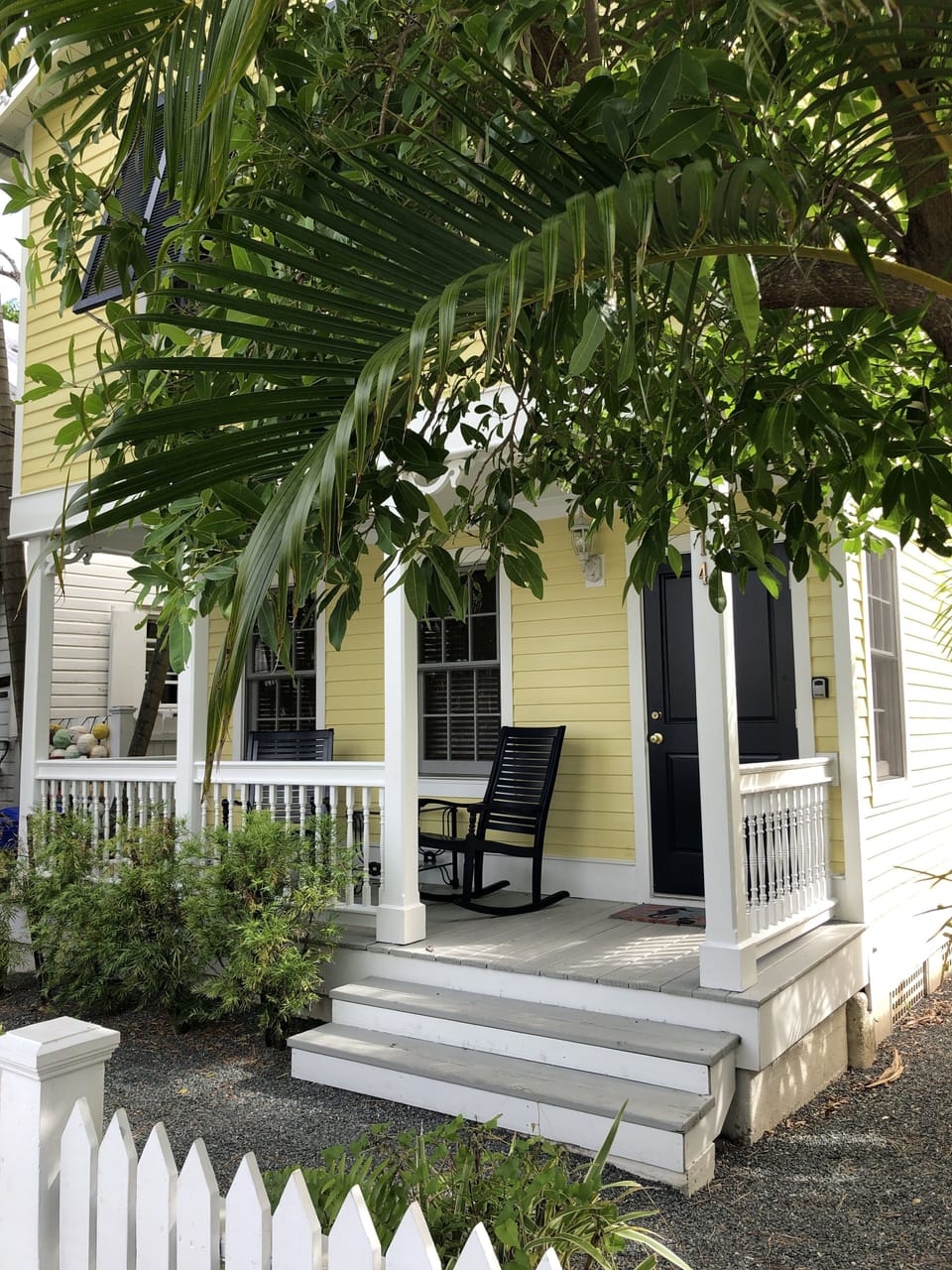 Front porch of home.  Front door is for entrance to the upper unit.