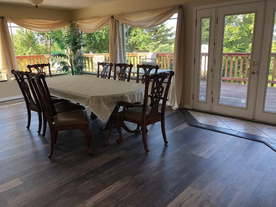 Large family dining room with more sitting area off the deck.  