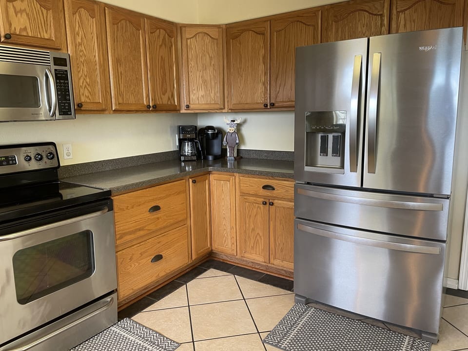 Newer appliances and lots of Corian counter top space.  