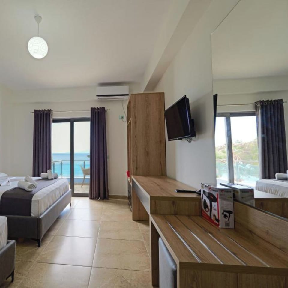 Triple Room, Sea View | Desk, iron/ironing board, free WiFi, bed sheets
