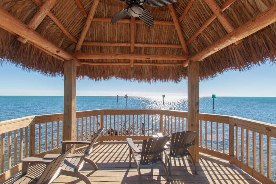 Covered seating area located at end of pier adjacent to the marina. A beautiful place to watch the sunset in the morning while sipping your favorite morning beverage.