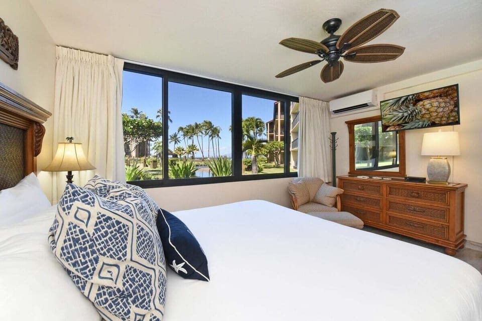 Wake to palm‑framed views that blur indoors with paradise.