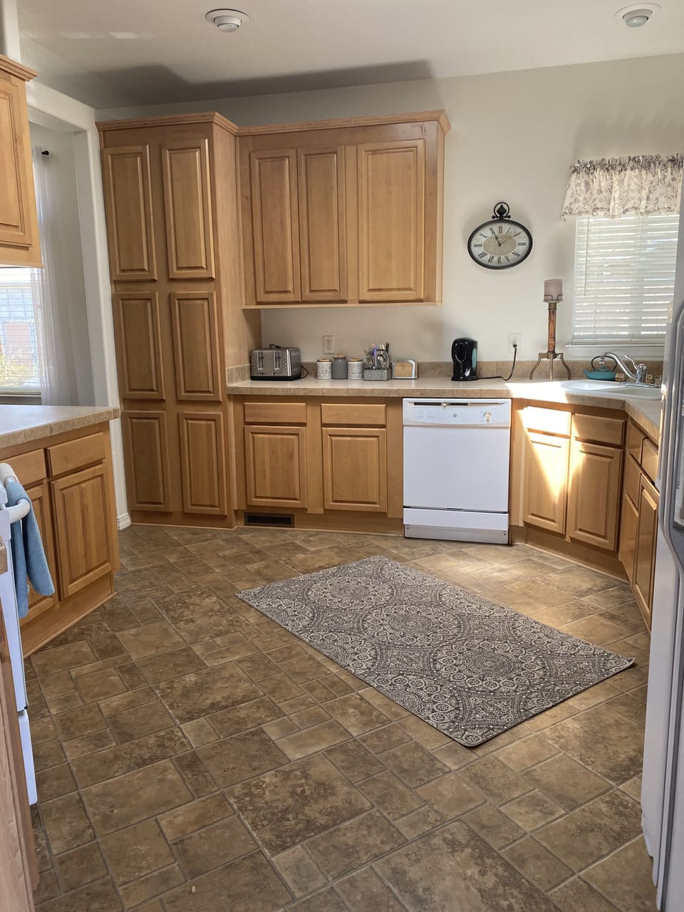 Kitchen entry beside front door, stocked with all the basics