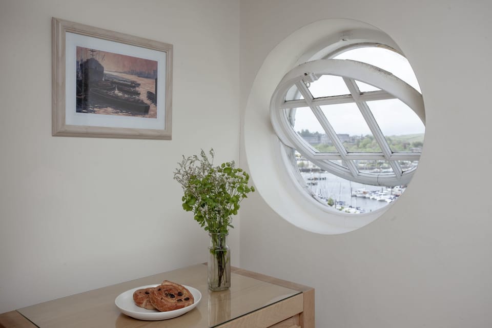 Porthole window with view from master bedroom - Waterview House