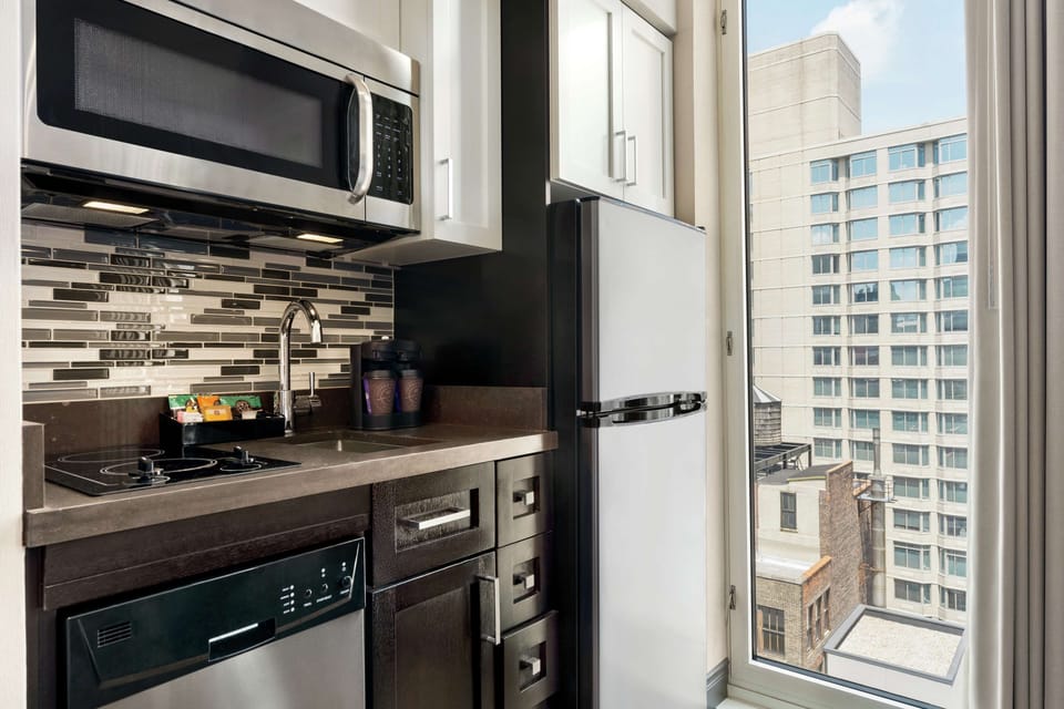 Studio, 2 Queen Beds, Non Smoking | Private kitchen | Full-size fridge, microwave, coffee/tea maker, cookware/dishes/utensils
