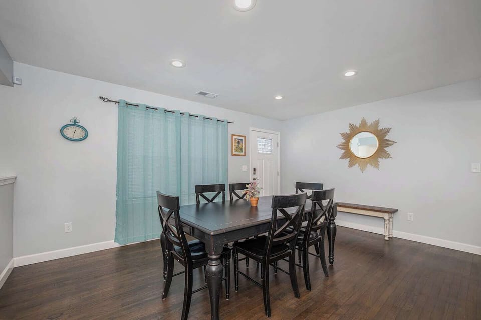 Lively wooden dining table, build in a vintage fashion, is a setting for memorable family meals.